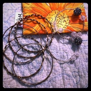 Jewelry bracelets- 5 Gold Colored and 2 Siver